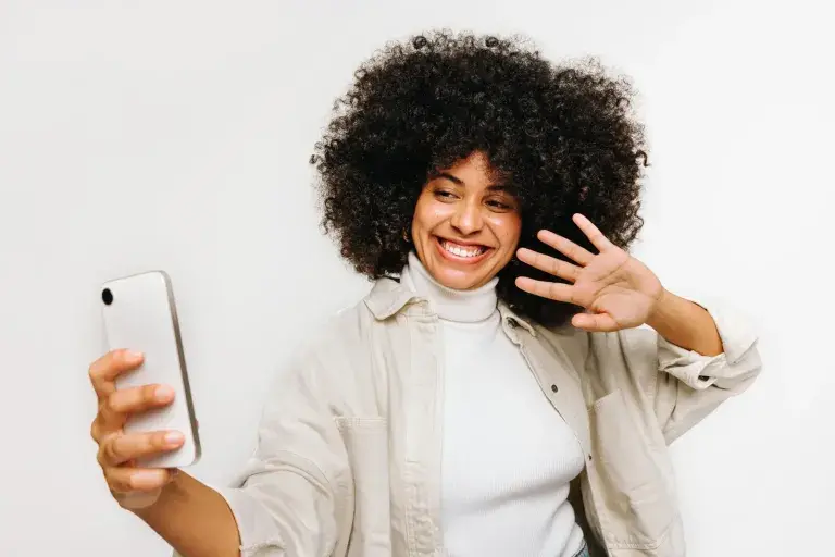 woman taking a selfie with her phone